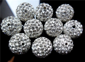 Macro shot of 5mm large hole disco ball beads with silver rhinestones on black background