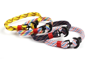 Detail of multi-color anchor bracelets made of woven 550 paracord with black metal clasps
