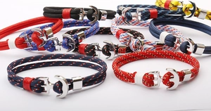 Close-up of braided paracord anchor bracelets in various colors with metal clasps