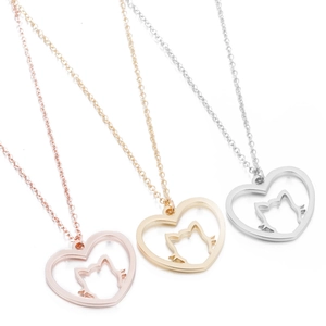 Hollow heart and cat silhouette pendants in rose gold, gold, and silver stainless steel