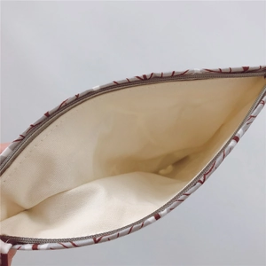Detail view of large interior capacity and smooth zipper of the canvas coin purse