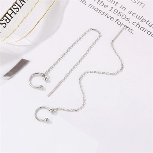Minimalist silver chain drop earrings with C-shaped ear cuffs on a silky ribbon