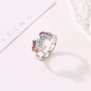 Detailed view of unicorn ring featuring colorful rhinestones and adjustable open band