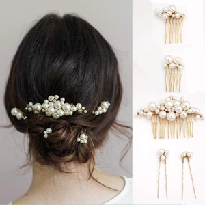 Detailed view of baroque pearl hair pin set featuring bridal combs with gold metal structure
