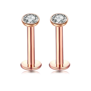 Rose gold stainless steel labret studs with round cubic zirconia in a bezel setting