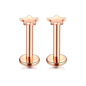 Close-up of rose gold star-shaped stainless steel ear studs with a polished finish