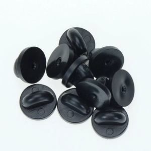 Set of ten black rubber pin backs for brooches on a plain white background