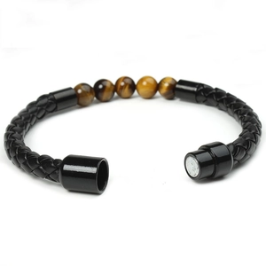 Detail of men's leather braided bracelet with tiger eye beads and magnetic clasp
