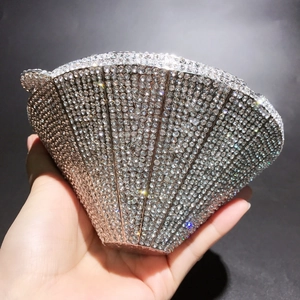 Macro shot of silver diamond evening clutch bag with sparkling rhinestone surface details