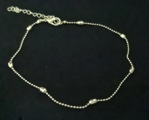 Detail of silver beaded heart anklet with lobster clasp and adjustable extension chain