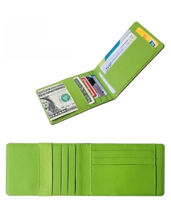 Macro detail of green leather wallet showing card slots and elastic strap closure