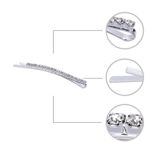 Detail showing claw-set rhinestones and smooth silver metal finish on hair clip