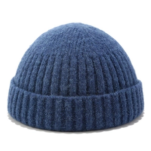 Solid navy blue ribbed knit skull cap beanie for men and women in winter style