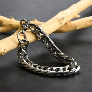 Polished silver double weave curb chain bracelet displayed on a natural wood branch