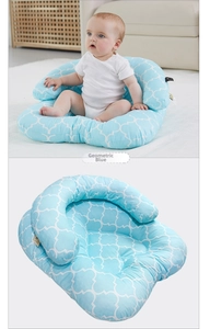 Detail of light blue geometric baby support sofa showing u-shaped ergonomic seating