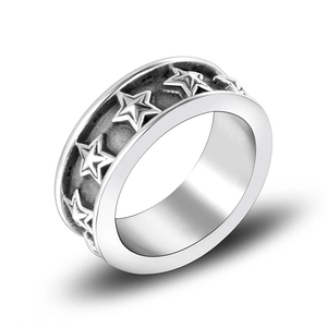 Vintage titanium steel star ring with embossed patterns and polished inner band