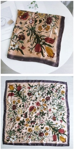 Detail of floral silk scarf showing vintage tulip print and premium satin texture