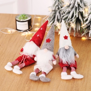 Three Nordic Christmas gnomes with striped legs and star hats for home festive decor