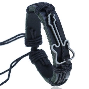 Handcrafted black braided leather bracelet featuring a silver guitar charm with adjustable cord