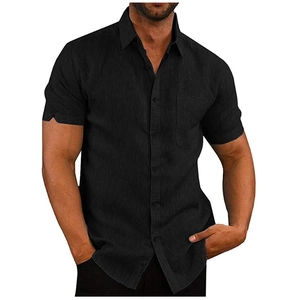 Detail of black short sleeve linen shirt with turndown collar and chest pocket