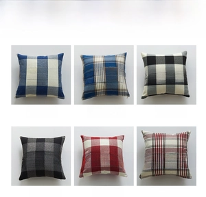 Detail of six plaid linen pillowcases in navy blue, black, and red checkered patterns