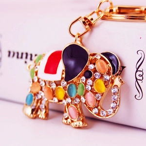 Golden elephant keychain with opal gemstones and sparkling rhinestones for bags