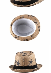 Detail view of straw hat inner label showing 100% paper material and size 58 dimensions