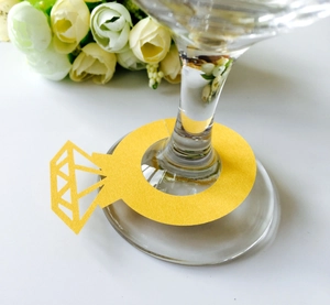 Laser-cut diamond ring shaped yellow paper wine glass place cards for wedding table decor