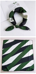 Detail showing diagonal stripe silk scarf in dark green and black for versatile styling