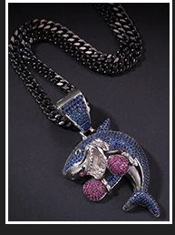 Macro view of iced out shark pendant with colored rhinestones on black Cuban chain