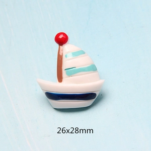 Detail view of 26x28mm resin sailboat charm for DIY crafts and phone case decor