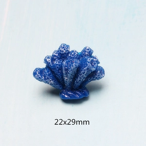 Macro shot of 22x29mm blue resin coral charm for DIY jewelry and phone case crafts