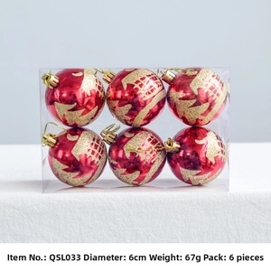 Detail of 6cm red Christmas ornaments with gold glitter patterns in transparent box
