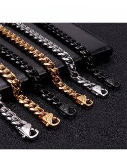 Detail of Cuban link bracelets in gold, silver and black with secure lobster clasp closures
