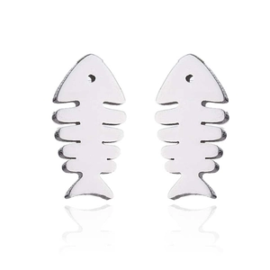 Close-up of minimalist silver fishbone stud earrings with a polished metallic finish