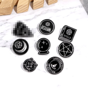 Set of punk witch enamel pins featuring spell books and mystical magic black cat designs