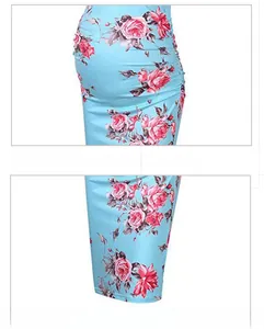 Detail of light blue maternity dress with rose print and ruched waist tailoring