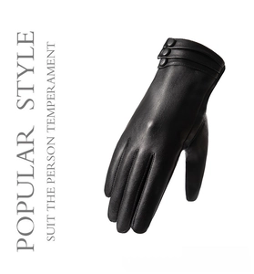 Detail of elegant black PU leather winter gloves with decorative wrist buttons