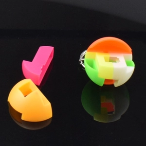 Detail of multi-color 3D puzzle ball keychain with interlocking plastic assembly parts