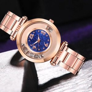 Rose gold watch with starry blue dial and floating rhinestones on metal strap