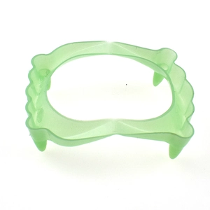 Luminous green vampire fangs for Halloween props, realistic glow in the dark plastic teeth