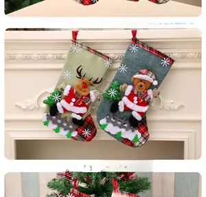 Detail of linen Christmas stockings featuring 3D reindeer and bear appliques on a mantel