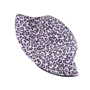 Detail of colorful purple leopard print on cotton bucket hat with a wide brim