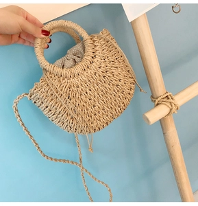 Handmade woven straw crossbody bag for women, cute round handle summer beach mini shoulder bag.