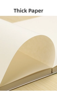 Close-up of the thickened cream-white sketch paper showing natural curl and fine texture