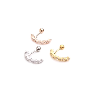 Three surgical steel helix earrings in gold, silver, and rose gold with zircon crystals