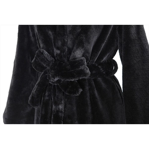 Long faux fur hooded coat in black featuring a soft texture and a waist tie-belt design