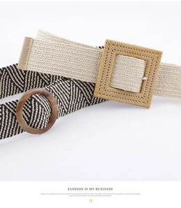 Detail of bohemian woven belts with square straw buckle and round amber resin buckle