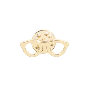 Detailed view of a gold-toned sunglasses brooch with a secure metal butterfly clutch back