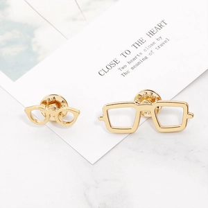 Set of gold metal sunglasses-shaped brooches featuring round and rectangular frames